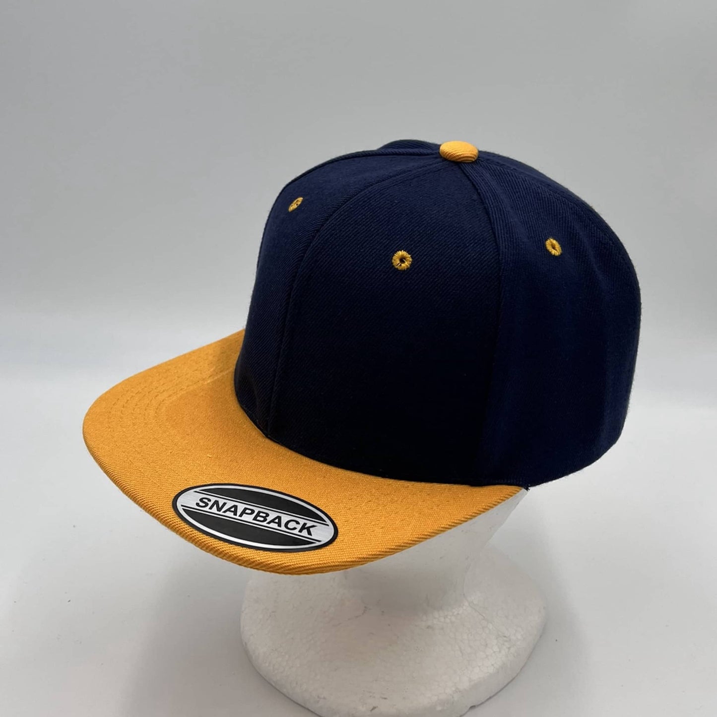 Alpha Omega Cap Plain Poly Snapback Navy Blue and Yellow Eyelets/Bill 12 pack PFS0545 Cap Hat