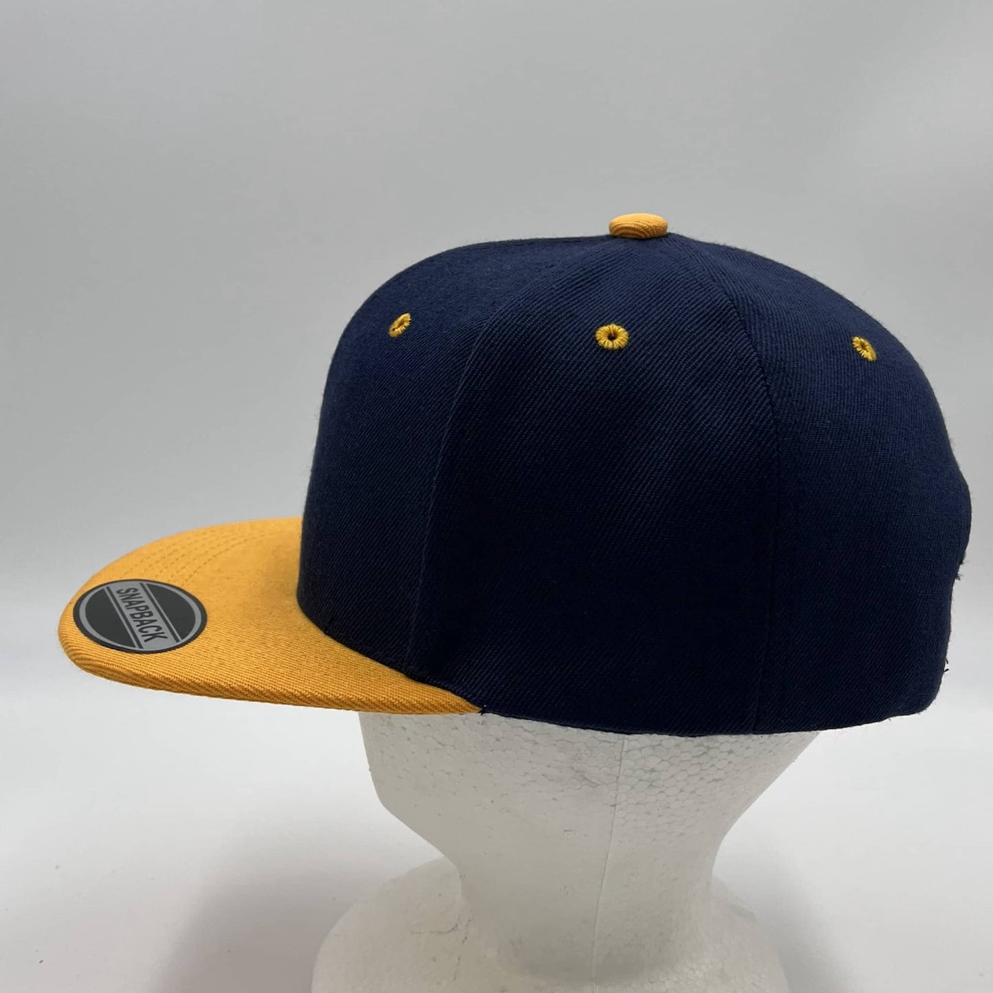 Plain Poly Snapback Navy Blue and Yellow Eyelets/Bill 12 pack PFS0545 Cap Hat