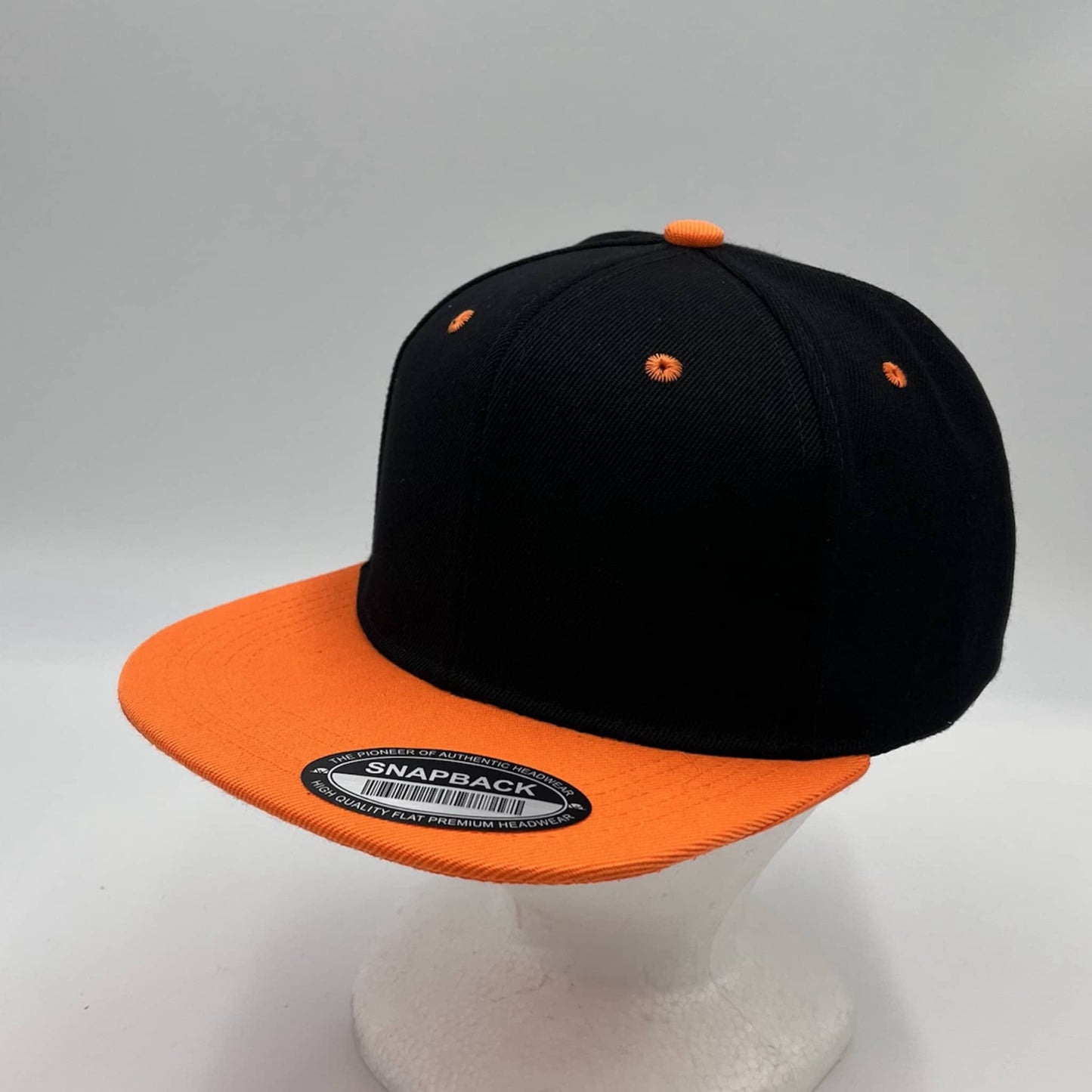 Alpha Omega Cap Plain Poly Snapback Black and Orange Eyelets/Bill 12 pack PFS0552 Cap Hat