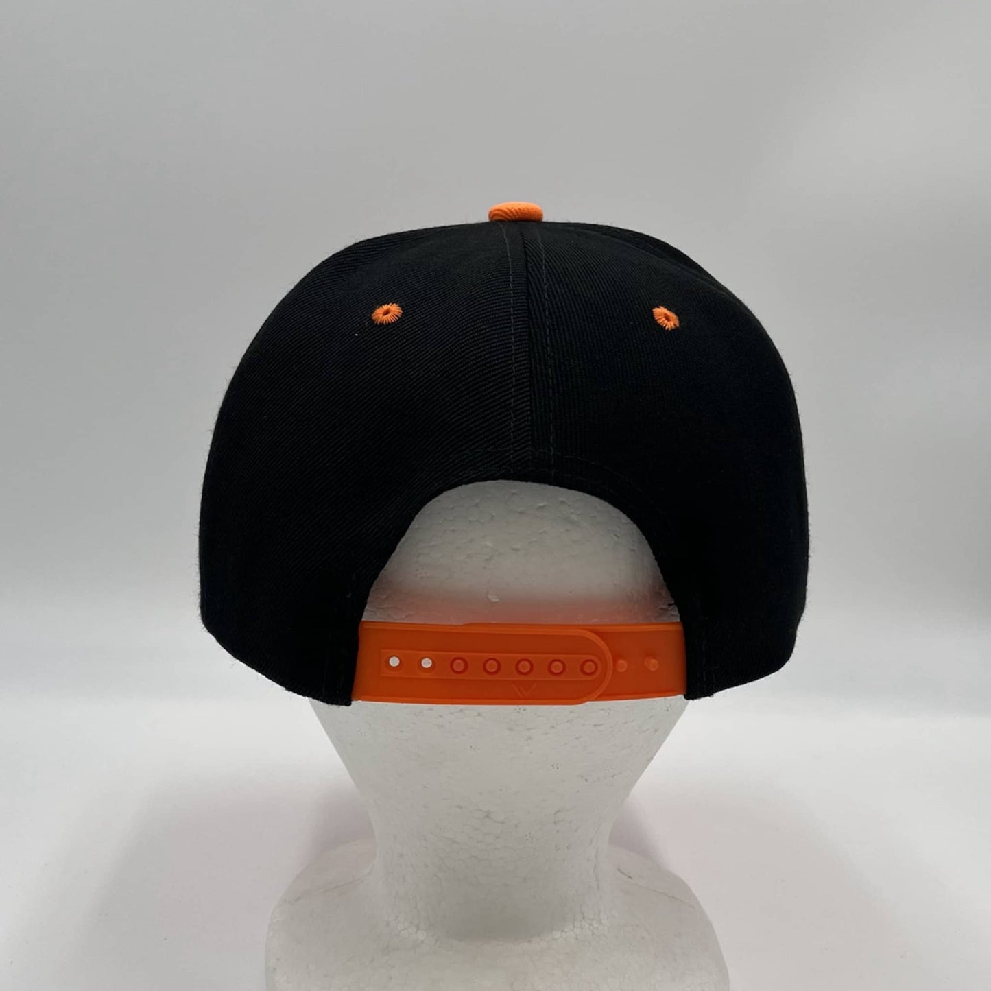 Alpha Omega Cap Plain Poly Snapback Black and Orange Eyelets/Bill 12 pack PFS0552 Cap Hat