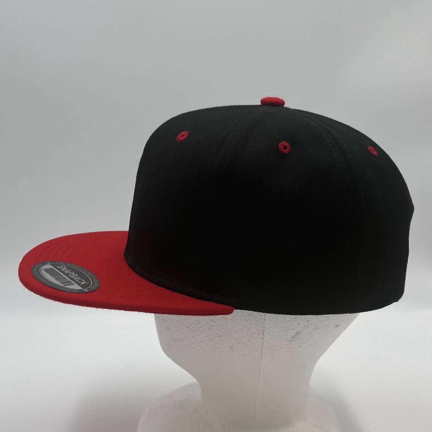 Alpha Omega Cap Plain Poly Snapback Black and Red Eyelets/Bill 12 pack PFS0559 Cap Hat