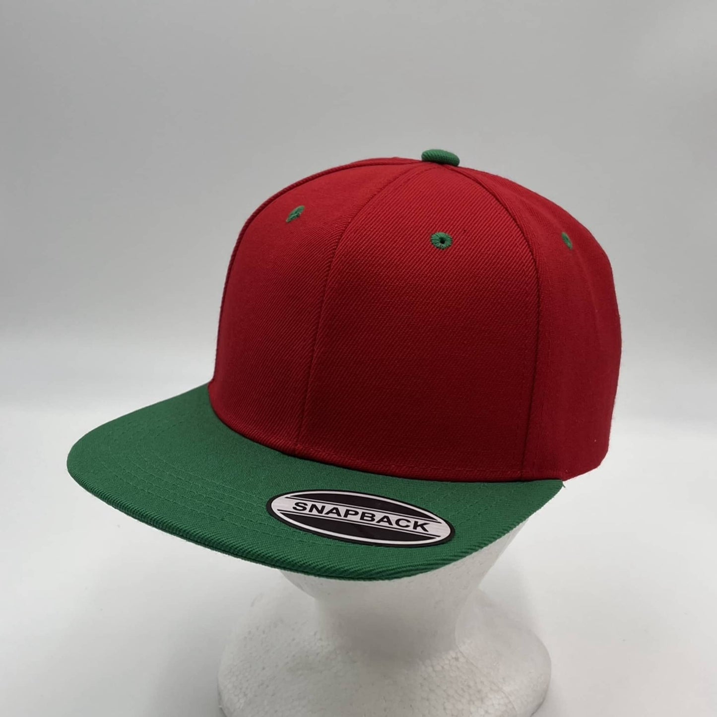 Alpha Omega Cap Plain Poly Snapback Red and Green Eyelets/Bill 12 pack PFS0557 Cap Hat