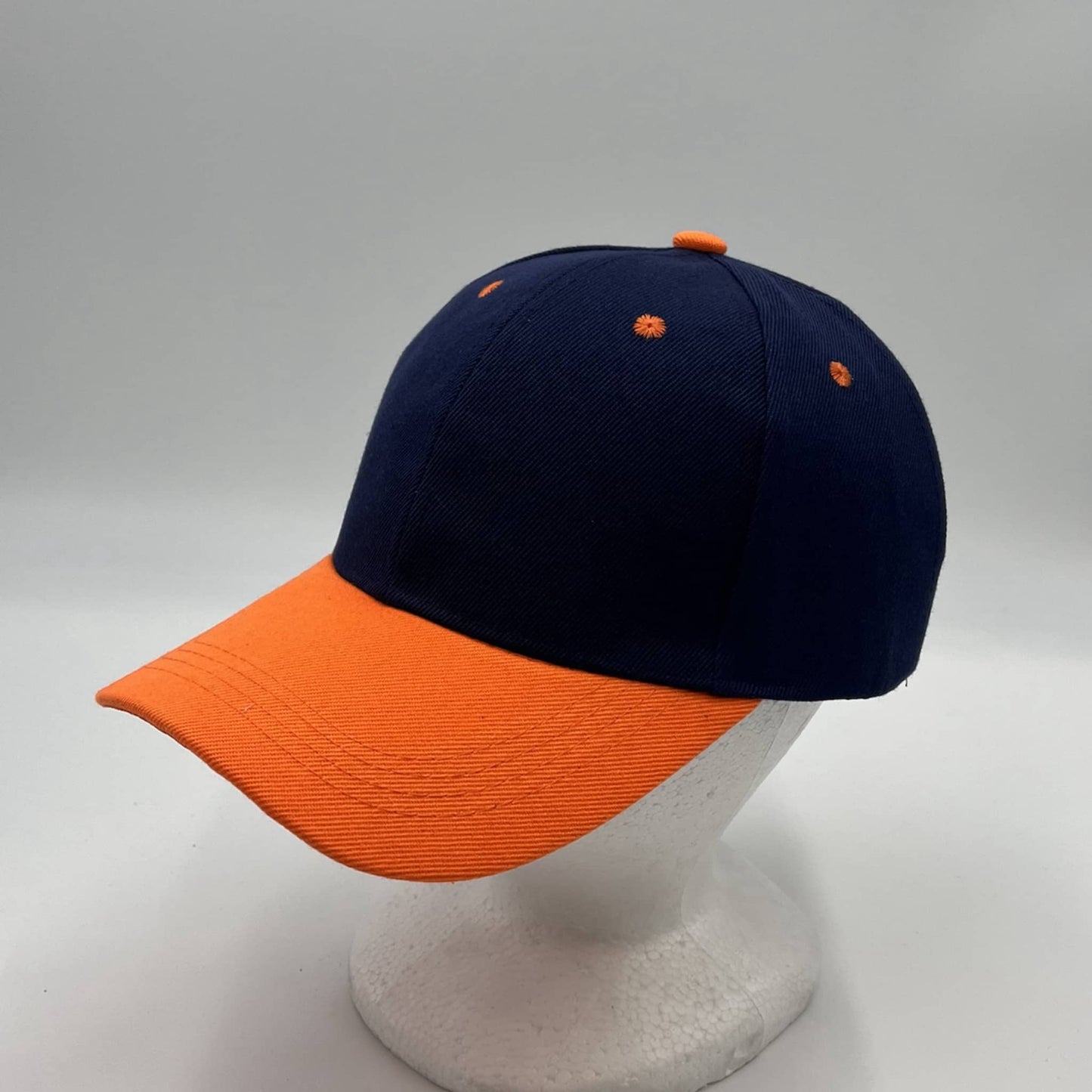 Alpha Omega Cap Plain Two Tone Velcro Navy Blue and Orange Eyelets/Bill 12 pack PCV0215 Cap Hat